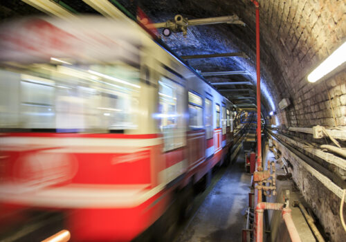 gloomy-metro-tunnel-view-with-moving-train-scaled.jpg