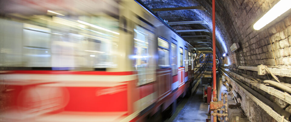gloomy-metro-tunnel-view-with-moving-train-scaled.jpg